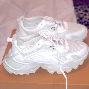 Brand new white athletic shoes.